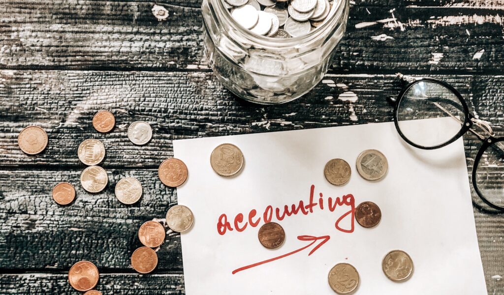 Accounting euro coins on table